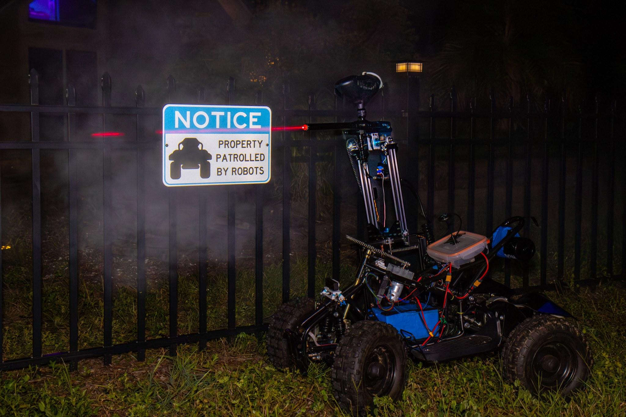 Sentry Bot with warning sign in background